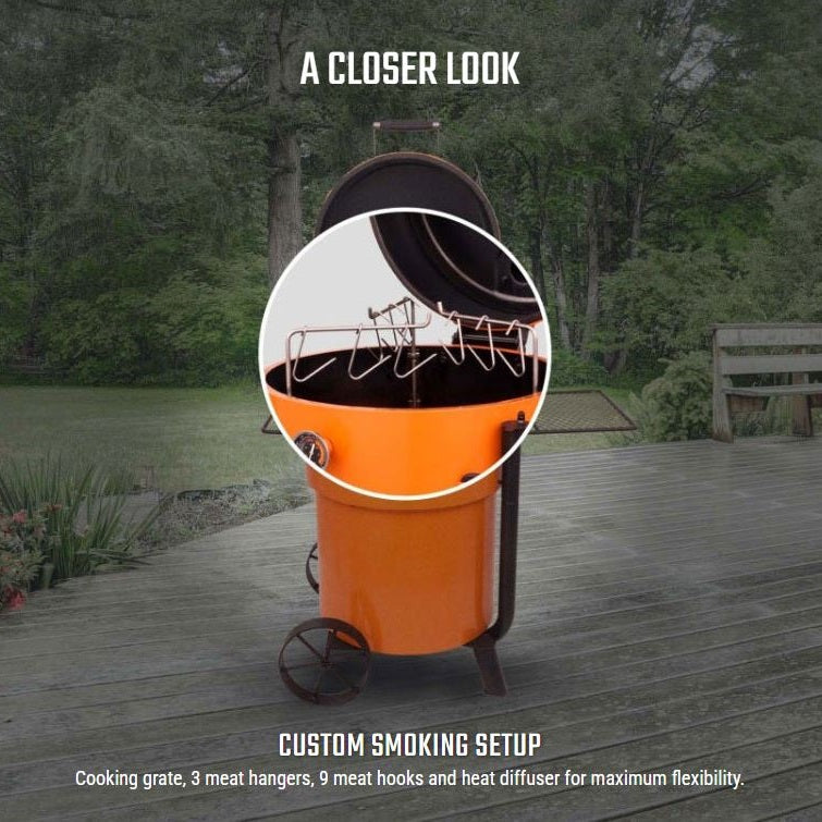 Outdoor photo of Oklahoma Joe’s Bronco Pro Charcoal Smoker in garden setting