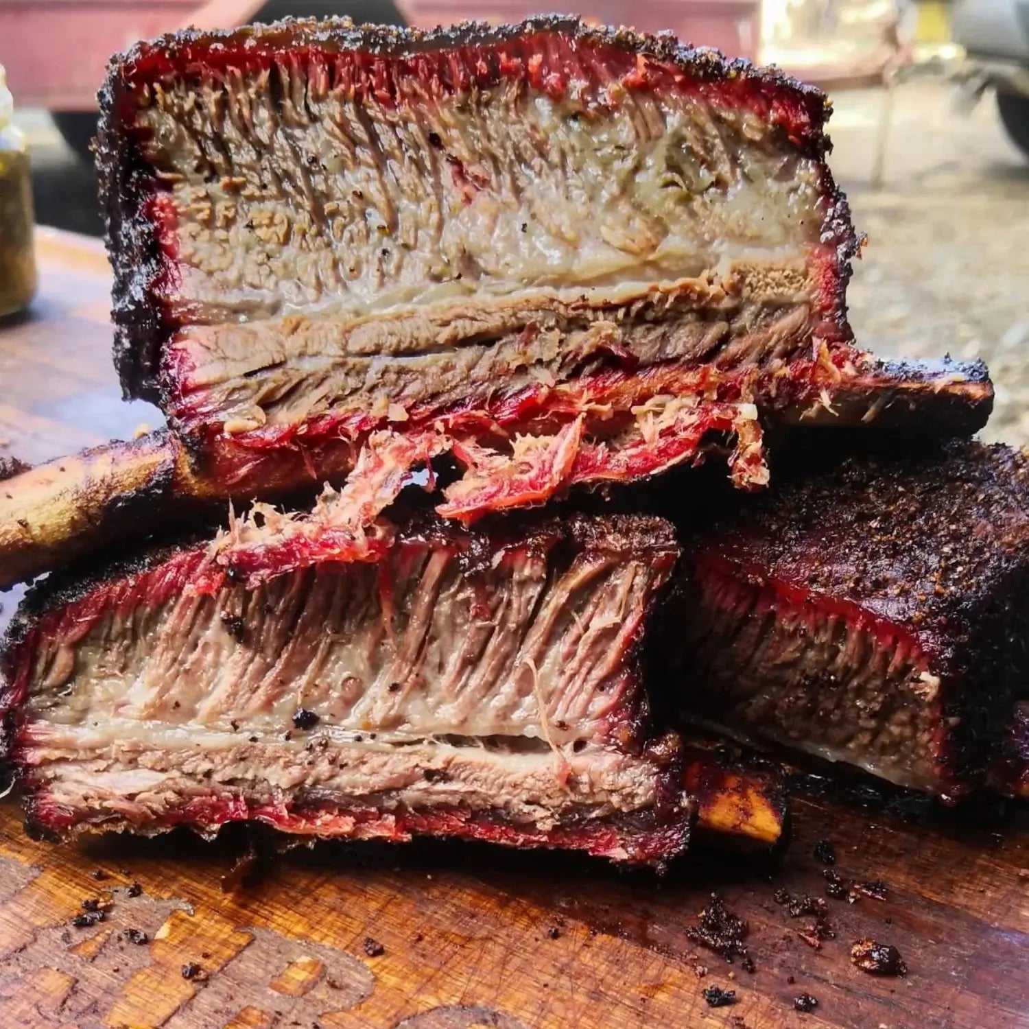 Smoked beef ribs seasoned with Carolina Smoke Everything BBQ rub showing bark and smoke ring