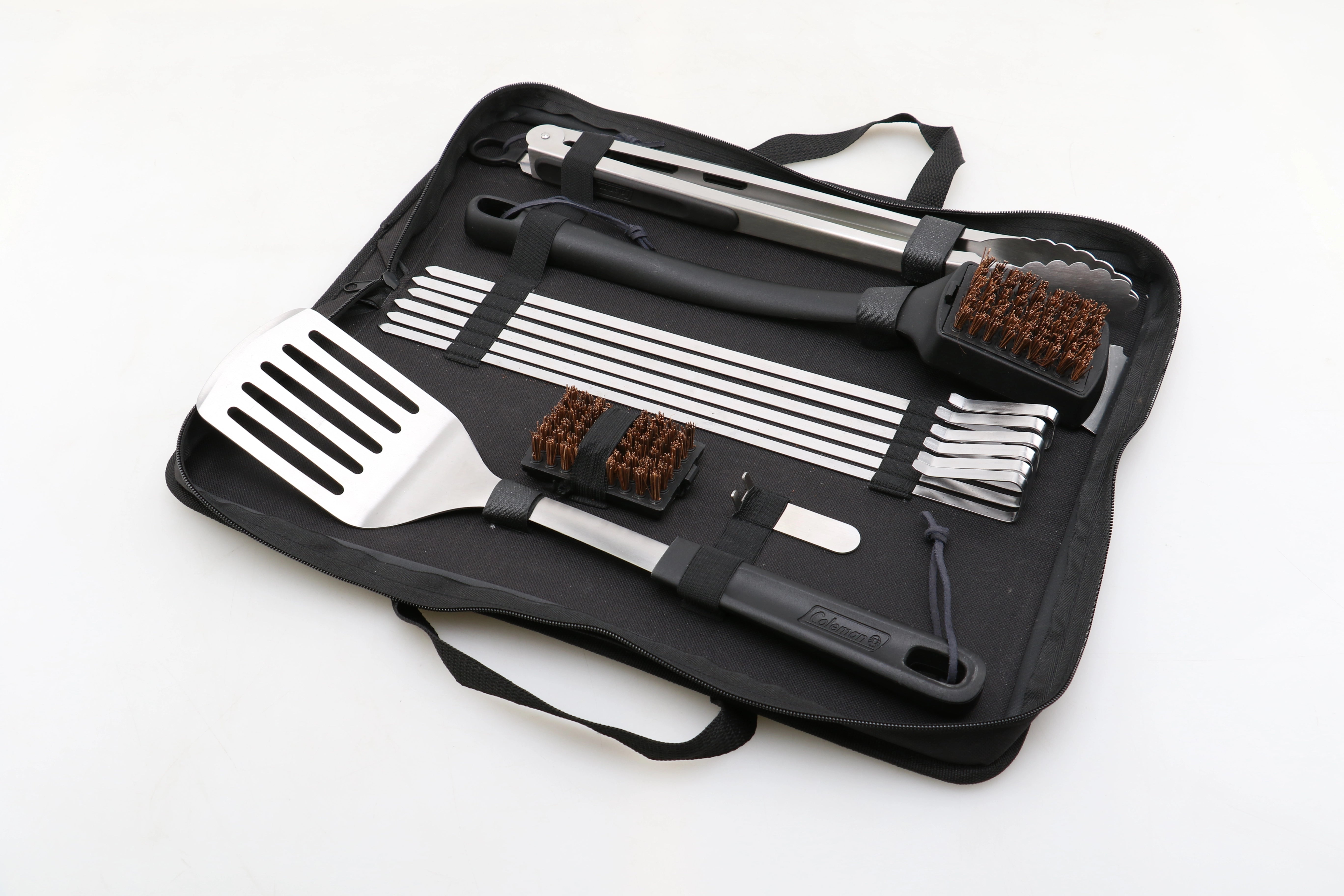 Coleman 12-piece BBQ tool set stored inside portable carry case with utensils secured in place