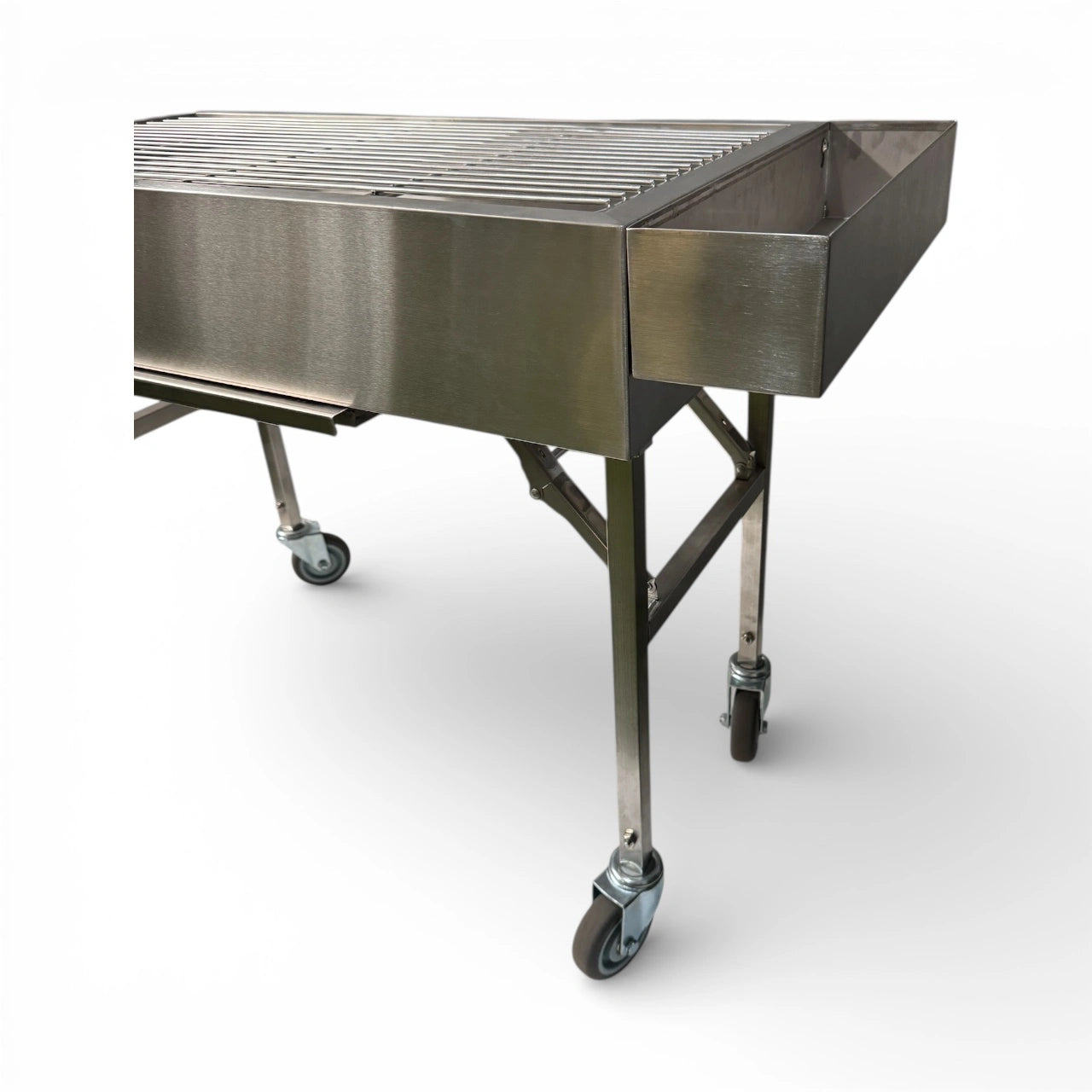 Corner angle of Family Portable BBQ showing foldable legs and castor wheels