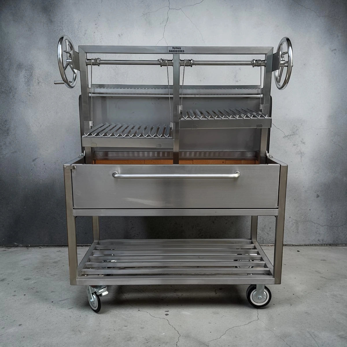 Heavy duty 304 stainless steel Parrilla BBQ with dual height adjustable charcoal grilling areas and commercial grade construction.