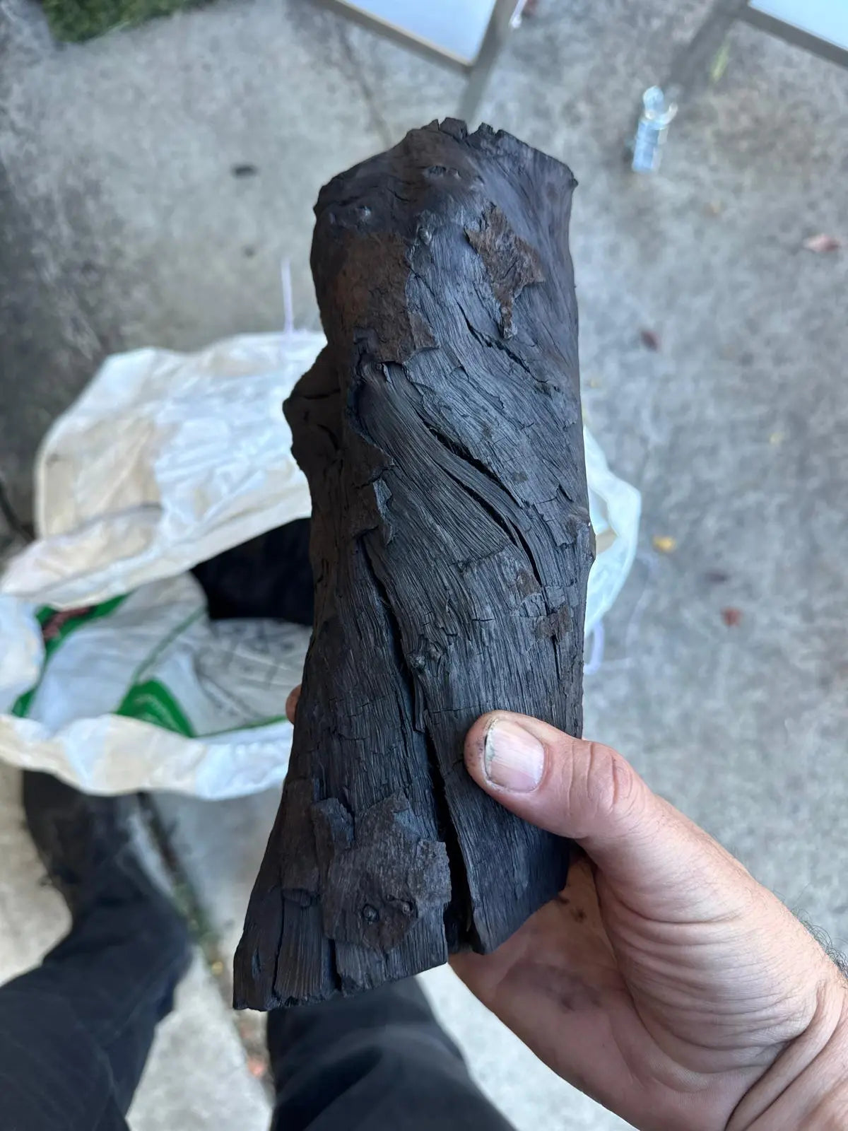 Extra large premium hardwood lump charcoal piece for long burn BBQ cooking and airflow performance in rotisserie and offset smokers.