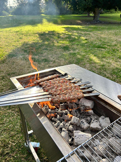 adana skewers on portable charcoal bbq grill