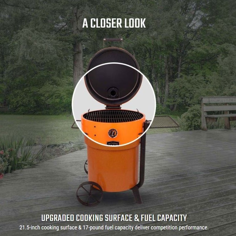 Lid open showing cooking space and fuel capacity of Bronco Pro Drum Smoker