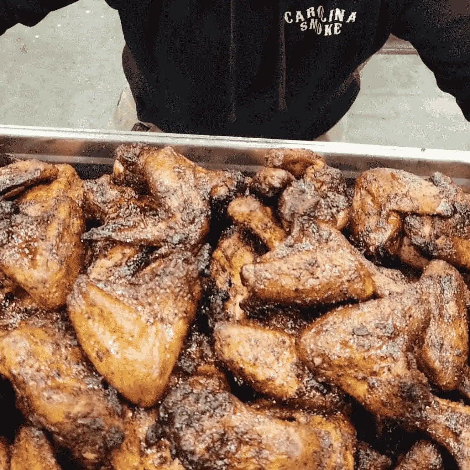 Chicken wings coated in Carolina Smoke Chicken and Pork seasoning ready for BBQ