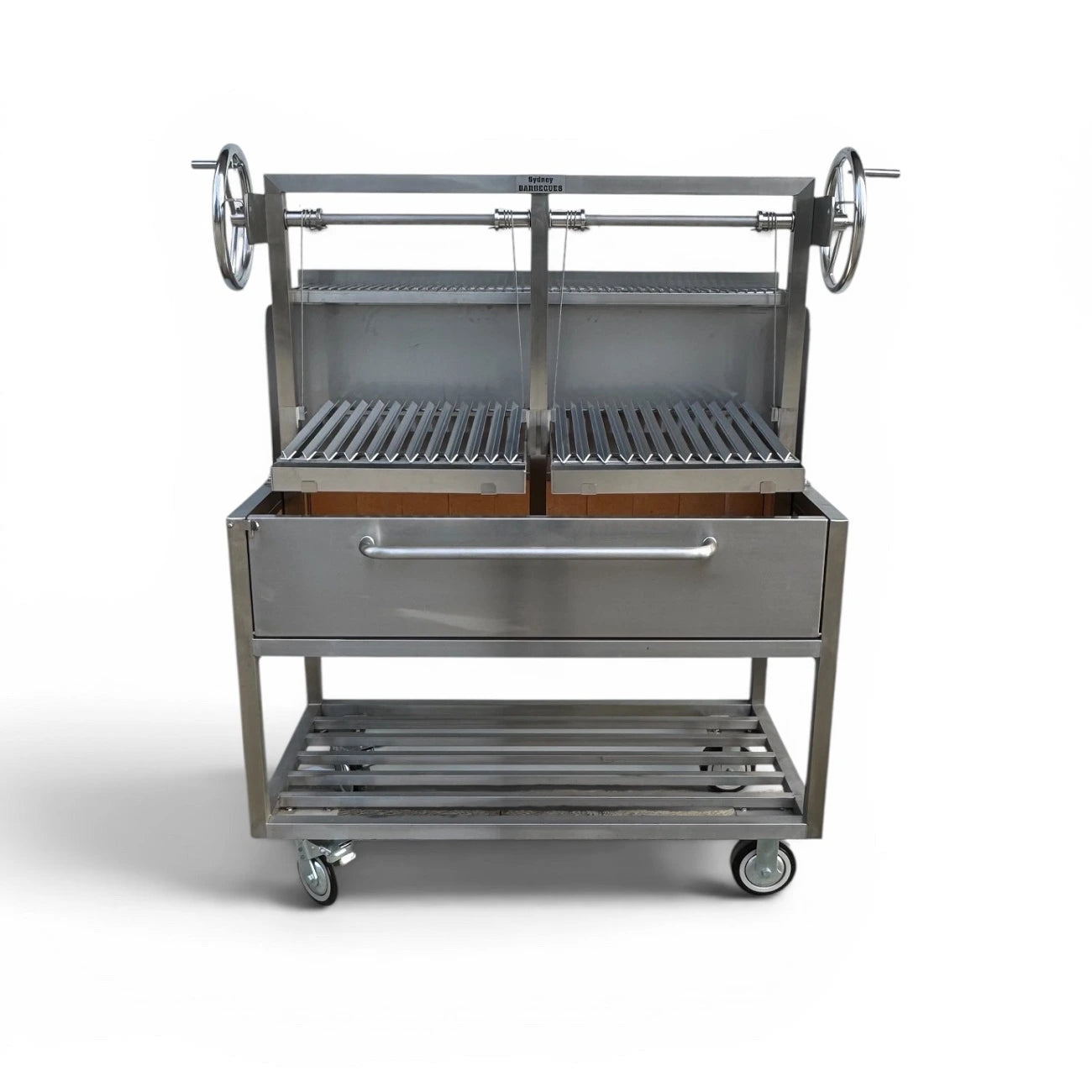 Front view of commercial 304 stainless steel Parrilla BBQ with dual height adjustable charcoal grilling areas and wheeled frame.