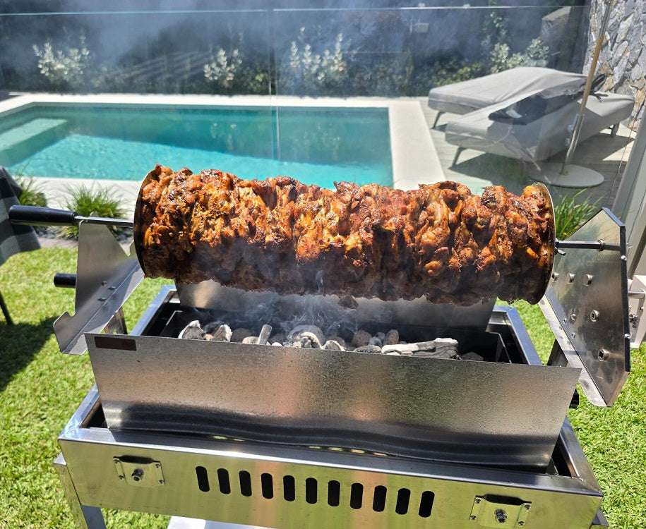 Cyprus BBQ cooking Gyros in front of a pool