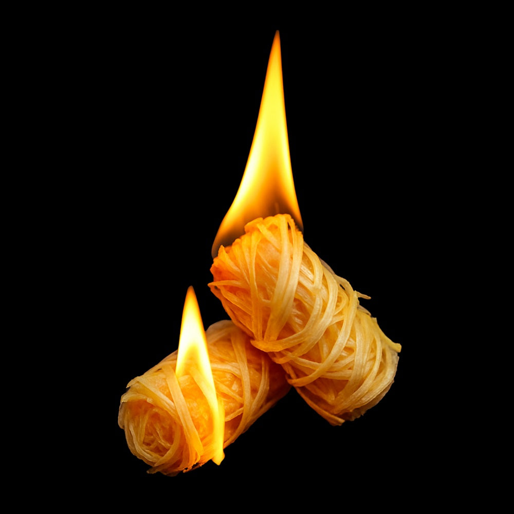 Two wood wool firelighters burning cleanly with bright flame – no smoke or chemical smell