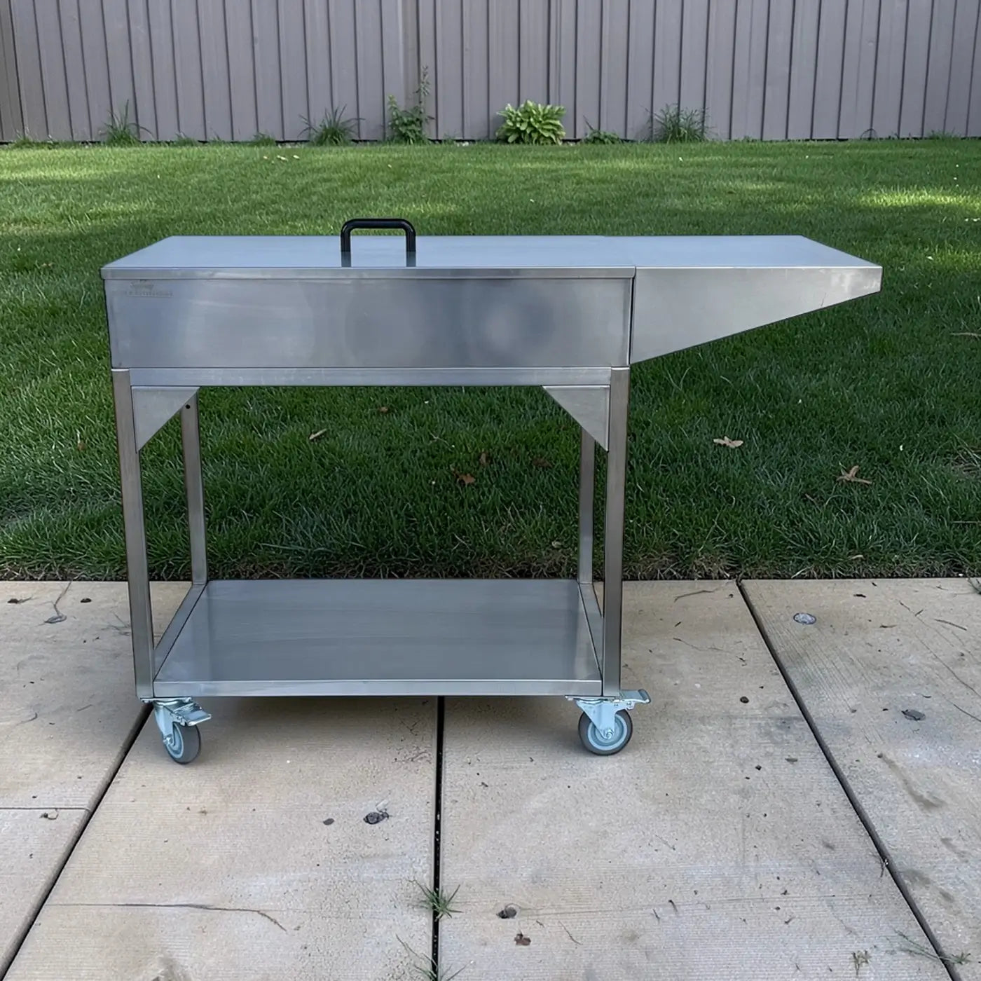 Stainless steel Family Barbecue HD charcoal grill in backyard setting