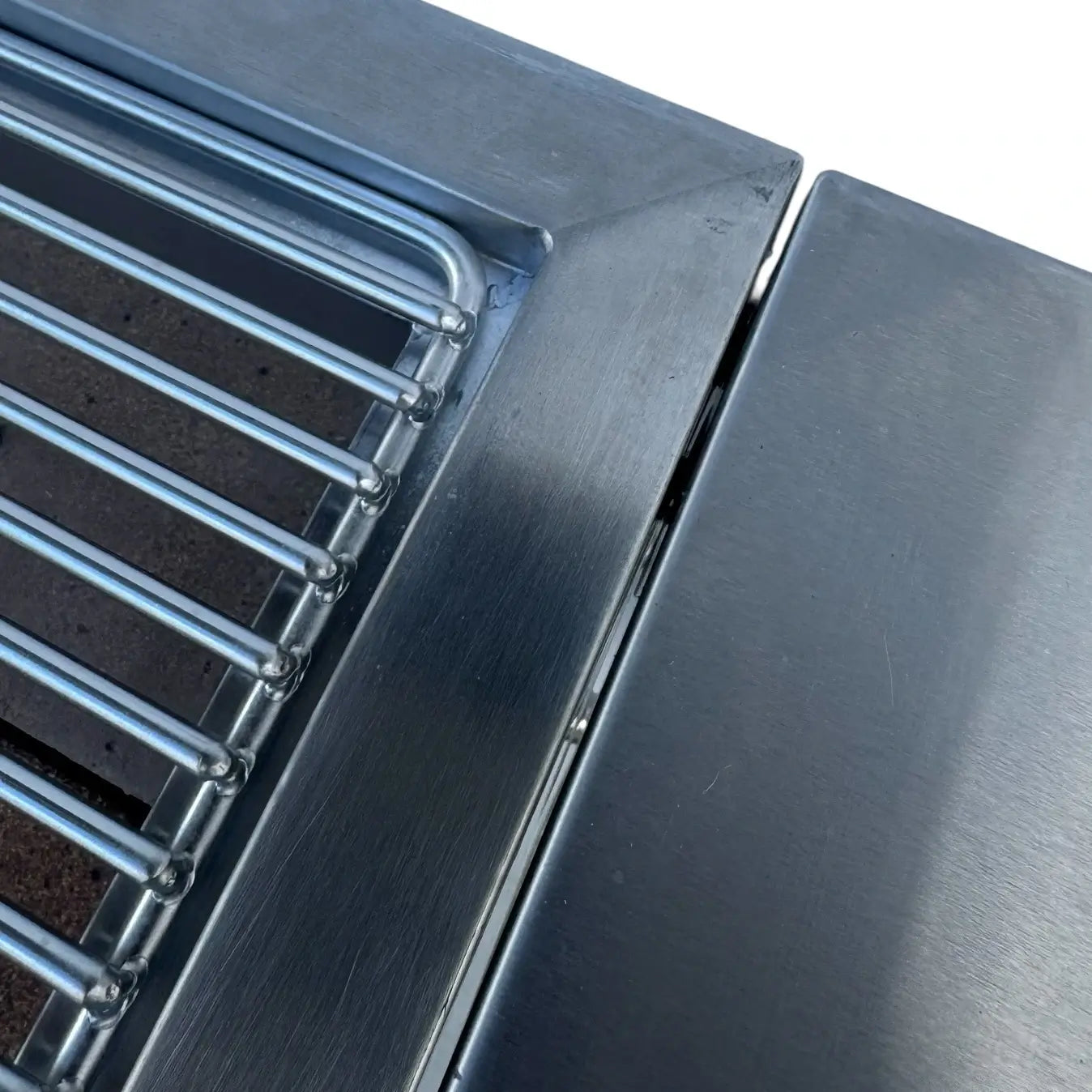 Close up of Family Barbecue HD stainless steel grill grate and reinforced construction
