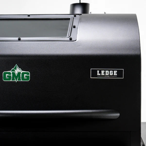 GMG Ledge logo close-up on the grill chamber