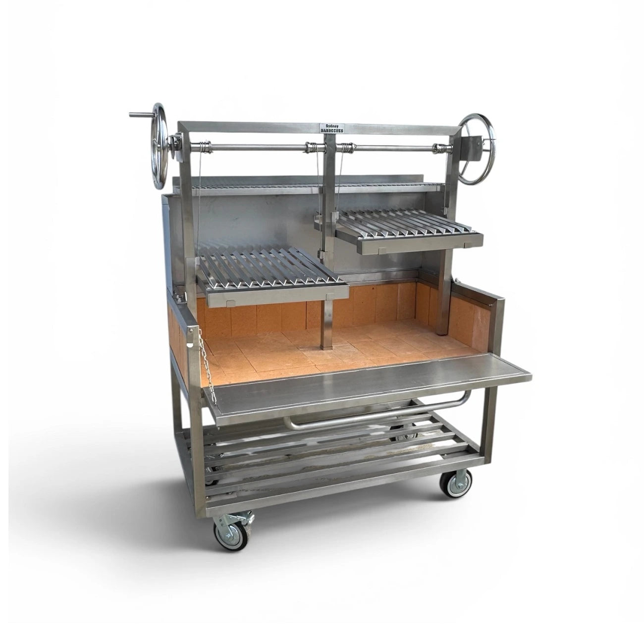 Heavy duty Parrilla charcoal BBQ with adjustable V grates, open charcoal management door, warming rack, and commercial stainless steel construction.