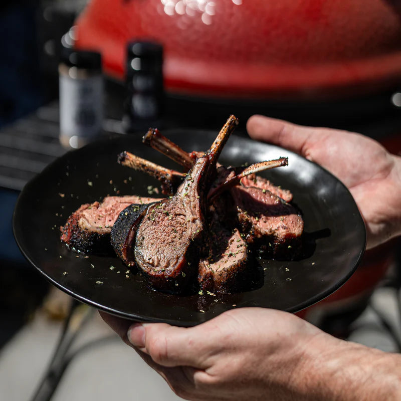 BBQ lamb rack seasoned with Lane’s Black Magic rub and sliced for serving
