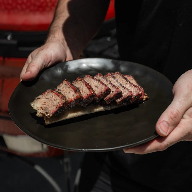 Sliced brisket with rich bark and smoke ring using Lane’s Black Magic seasoning
