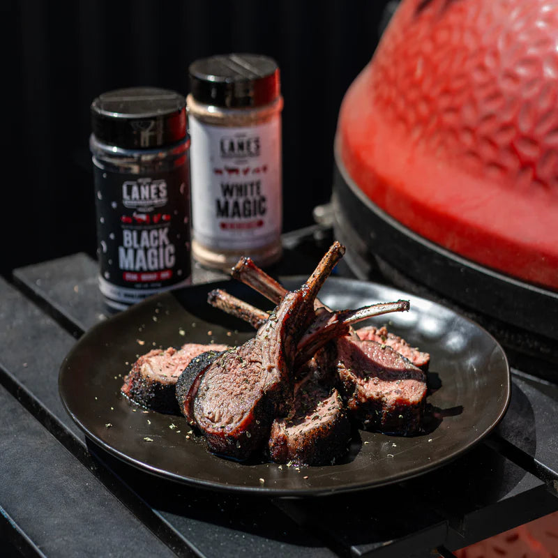 Grilled lamb cutlets plated with Lane’s White Magic and Black Magic rubs in background