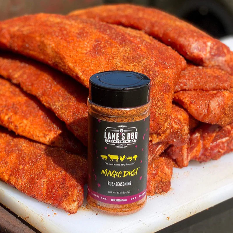 Raw pork ribs coated in Lane’s Magic Dust BBQ seasoning before cooking