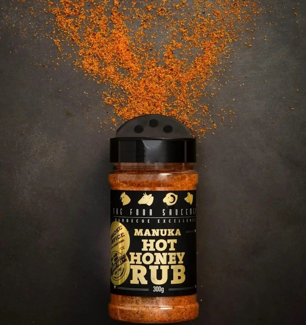 Manuka Hot Honey Rub with vibrant red spice blend scattered in the background