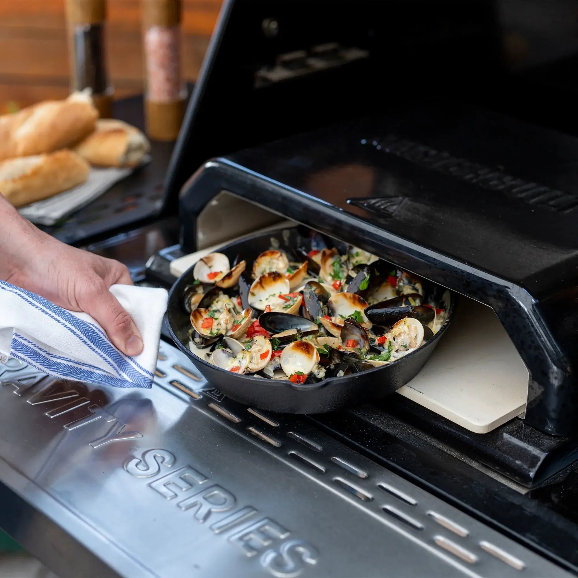 Pizza oven accessory cooking food on the Masterbuilt Gravity Series 1150 BBQ