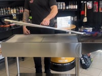 Demonstration of the Entertainers Stainless Steeel BBQ, showing size and features