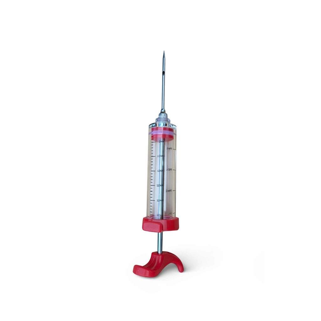 30ml marinade injector upright with measurement markings and stainless steel needle attached