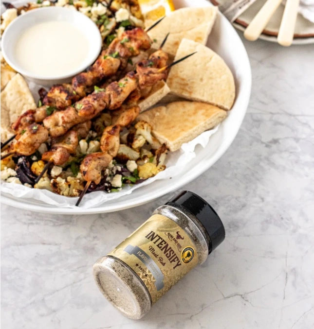 Rum and Que Intensify BBQ rub served with grilled chicken skewers and flatbread