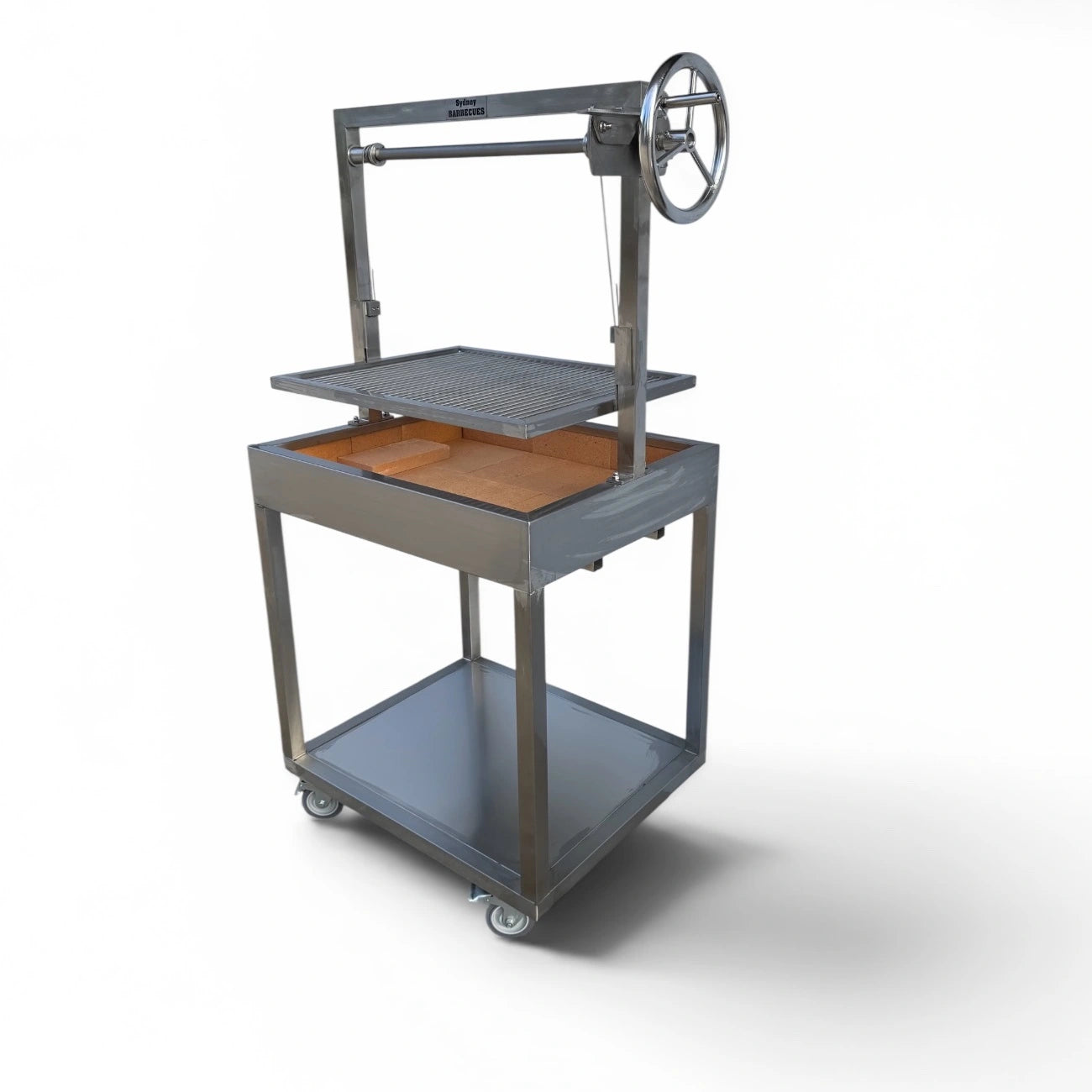 Small Argentinian style charcoal grill with adjustable cooking grate, fire brick lining, and stainless steel frame.