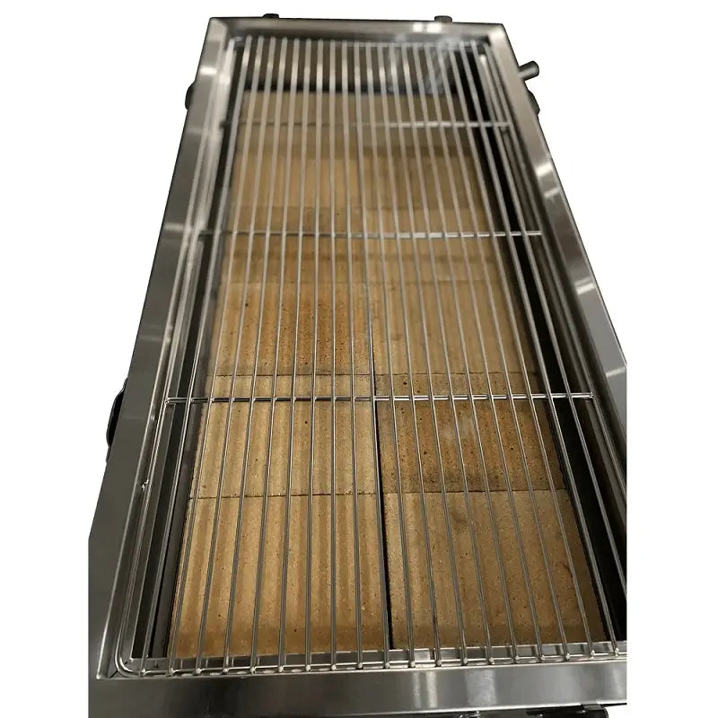 Top-down view of XL charcoal BBQ grill rack with firebrick lining